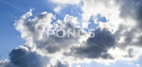 Heavenly landscape with clouds. Cumulus clouds in the sky Stock Photos
