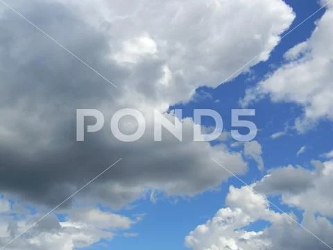 Heavenly sky between the white clouds and the radiant sun Stock Photos