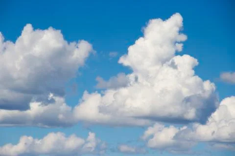 Heavenly sky between the white clouds and the radiant sun Stock Photos