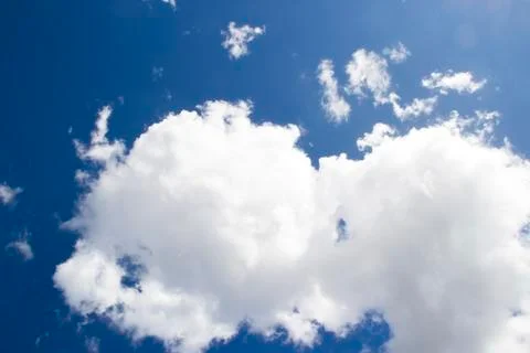 Heavenly sky between the white clouds and the radiant sun Stock Photos