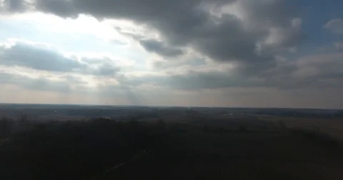 Heavenly Sky Clouds and Sun Rays Falling On Earth Drone Aerial Footage Pan Vídeos de archivo 88947187