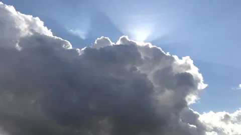 Heavenly sun appearing from behind cloud Stock Footage 159075414