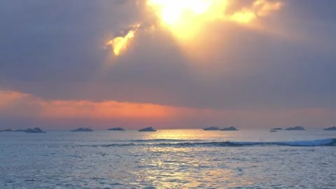 Heavenly Sun Rays Breaking Through Clouds Over Ocean Vídeos de archivo 281146479