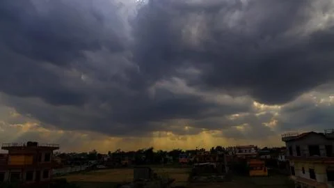 Heavenly Sun Rays Through Dark Clouds Against The Blue Sky. selective focus Stock Photos