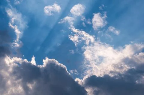 Heavenly sunrays through clouds Stock Photos
