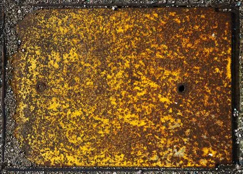 A heavily textured rectangular rusty metal plate Stock Photos