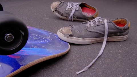 HEAVILY WORN SKATE SHOES DROP INTO Stock Video Pond5