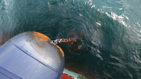 Heaving up anchor chain via rusty lead Stock Footage 62788908