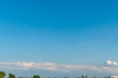 Heavy and compact group of clouds floating in the blue cyan pur gradient colo Stock-Fotos