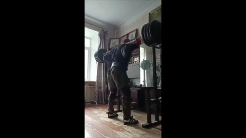 Heavy back squat goes wrong during home workout in Moscow, Russia Stock Footage 326768297