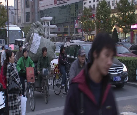 Heavy bicycle traffic, including cargo bikes, passing camera Stock Footage 86745655