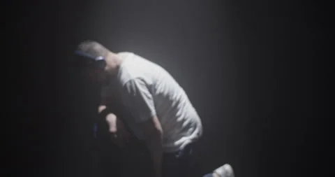 Heavy breathing dancer in spotlight Stock Footage 244523659