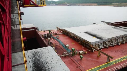 Heavy Cargo Operations on a Shipping Vessel while docked at the Port for loading Stock Footage 285961893
