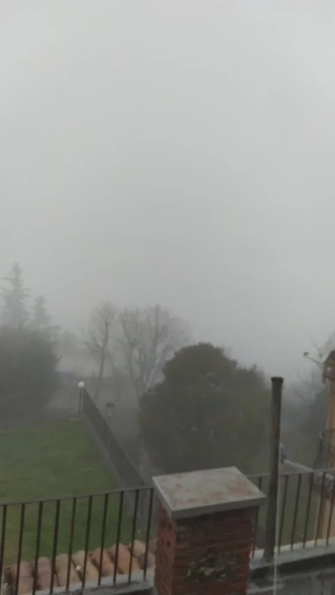 Heavy cloud passes and reveals the view of an Italian valley Vídeo Stock 146174940