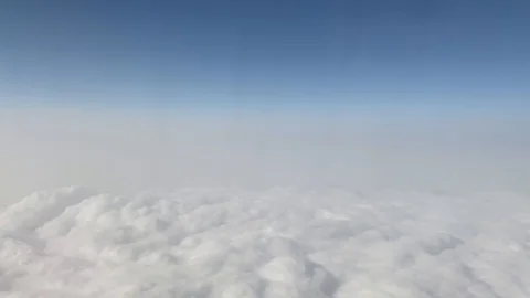 Heavy clouds in airplane window Stock Footage 123850942