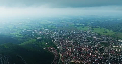 Heavy Clouds Approaching Small Town Aerial Opening Scene Cinematic Movement Zoom Video stock 300479660