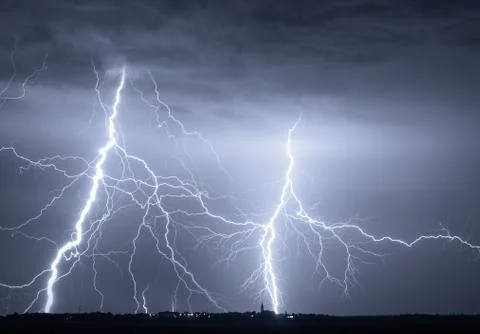 Heavy clouds bringing thunder, lightnings and storm Stock Photos