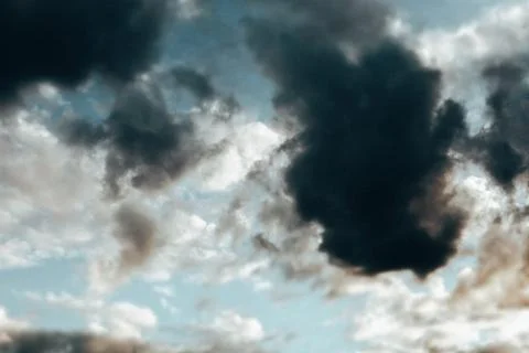 Heavy clouds. Cloudy changeable weather in spring. Dramatic sky. Stock Photos