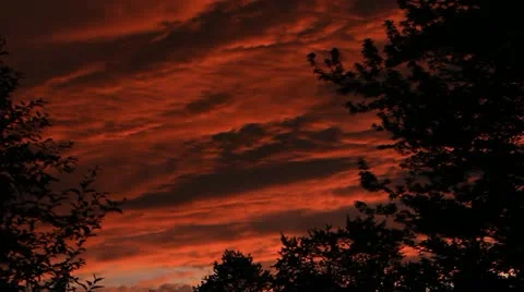 Heavy clouds cover in color at sunset Stock Footage 11290111