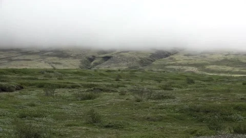 Heavy clouds hanging over mountain Stock Footage 136614632