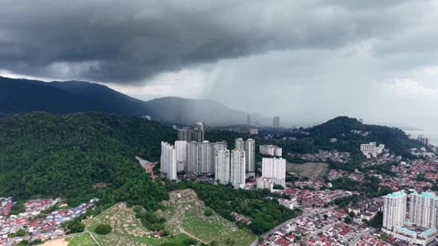 Heavy clouds loom over city and hills Stock Footage 344815708