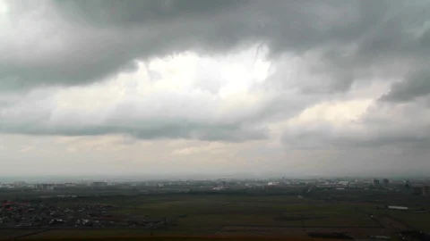 Heavy clouds moving over a city landscape Stock Footage 93781829