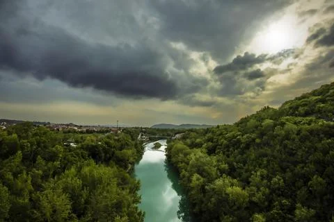 Heavy Clouds Over Soca River With Bicycle Bridge Stock Photos