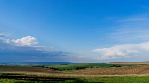 Heavy clouds passing above rural fields in South Moravia, Czech Republic. Video stock 89899209