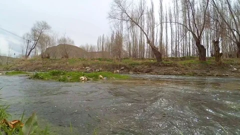 Heavy cloudy day stream current , panning time lapse Stock Footage 76047758