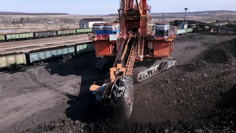 A heavy coal mining machine shovels coal with a bucket  Stock Footage 152625425