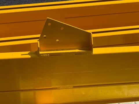 Heavy construction equipment is seen in a work area with bright yellow parts  写真素材