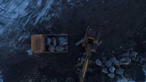 Heavy construction vehicles moving rocks on the coast in Vik, Iceland Stock Footage 122308431