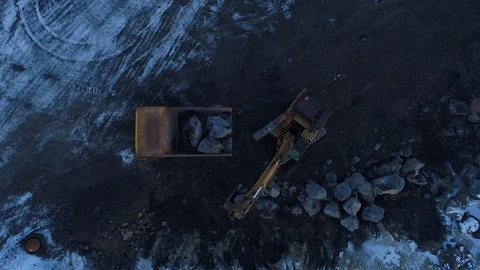 Heavy construction vehicles moving rocks on the coast in Vik, Iceland Stock Footage 122308439