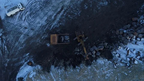 Heavy construction vehicles moving rocks on the coast in Vik, Iceland Stock Footage 122308440