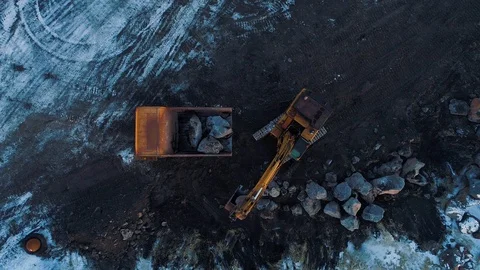 Heavy construction vehicles moving rocks on the coast in Vik, Iceland Stock Footage 122308443