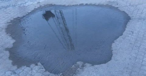 Heavy Crane Refliction water puddle on concrete Stock Footage 279911373