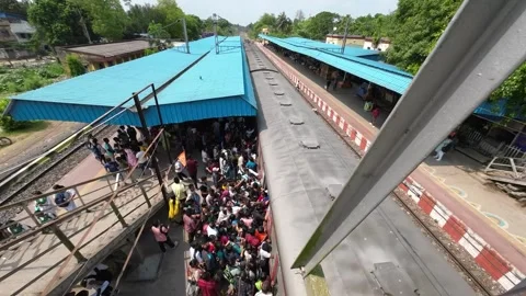 Heavy Crowd Boarding Local Train at Railway Station in Kolkata, West Bengal Stock Footage 312687432