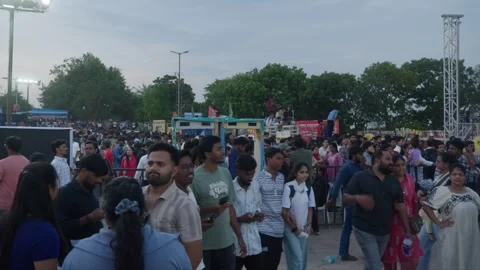 Heavy crowd with security metal detectors and high-mast lights on Grand Stock Footage 342895835