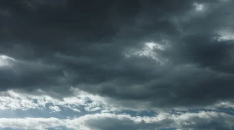Heavy, dark clouds above bright, sunny clouds 4k Video stock 49212889