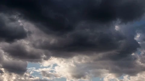 Heavy dark clouds drifting across the sky horizontally Stock Footage 115599782