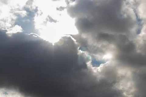 Heavy dark clouds with sunlight highlights Stock Photos