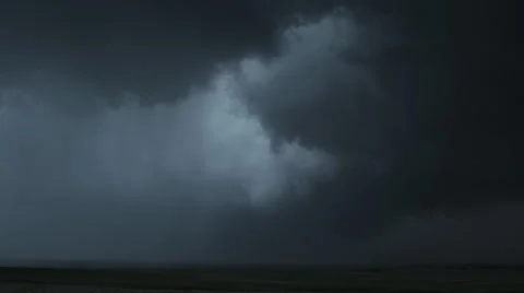 Heavy dark wall cloud dropping a curtain of rain over prairie, time lapse Stock Footage 59525545
