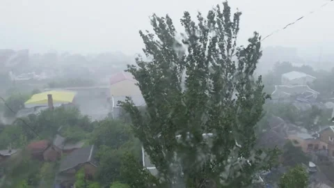 A heavy downpour outside the window, with large raindrops sliding down the .. Stock Footage 312122194