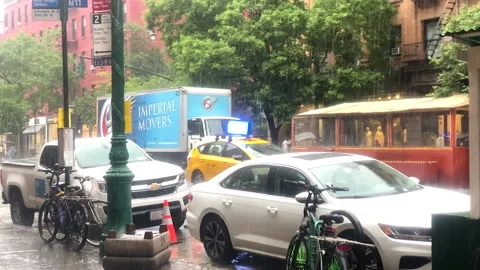 Heavy downpour over lower Manhattan traffic on a dreary summer day Stock Footage 201311055