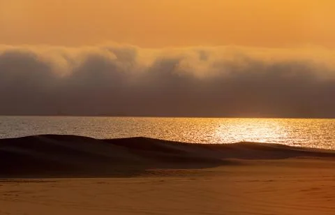 Heavy dramatic clouds and bright sky over the Atlantic Ocean. Beautiful afric Stock Photos