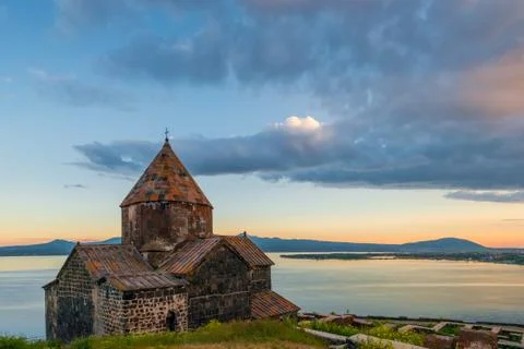 Heavy dramatic clouds over Lake Sevan and Sevanavank Monastery in Armenia 스톡 사진