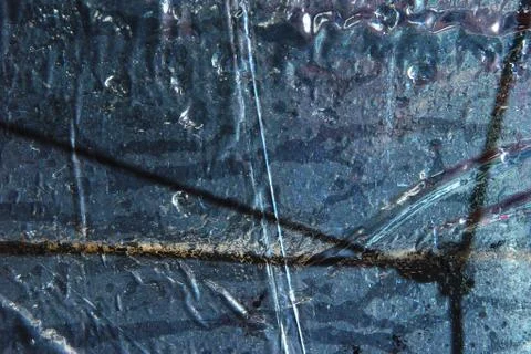 Heavy drops on plastic wrap with embossed background Stock Photos