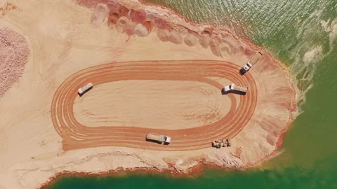 Heavy dump trucks moving earth at a mining quarry Stock-Footage 345007310