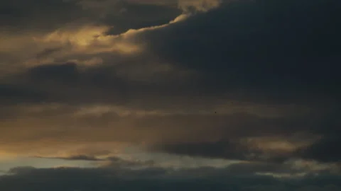 Heavy Dusk Sky with Patches of Warm Fading Light Stock Footage 344088059