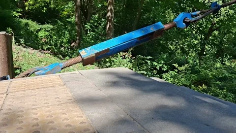 Heavy Duty Blue Tensioning Cable Securing a Steel Bridge Structure Vídeos de archivo 344600945